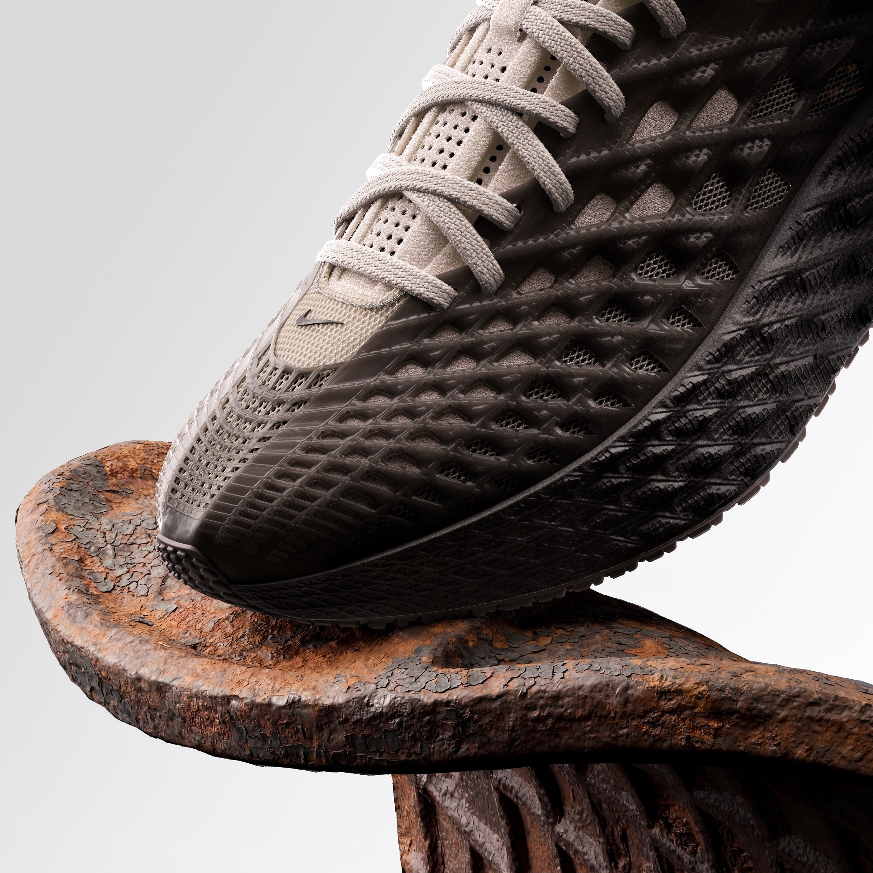 Nike Ava Edge toe resting on rusted metal