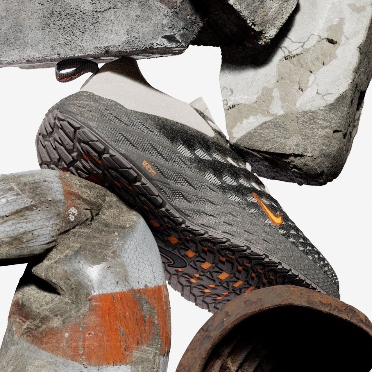 Nike Ava Edge outsole among concrete blocks and a rusted pipe